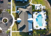 Thumbnail 43 of 92 - a birds eye view of a house with a swimming pool in the backyard