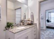 Thumbnail 10 of 92 - a white bathroom with a sink and a mirror