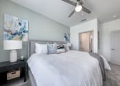 Thumbnail 87 of 92 - a bedroom with a large bed and a ceiling fan