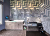 Thumbnail 67 of 92 - a bathroom with a sink and a tub and a patterned wall