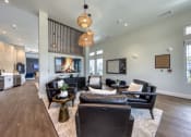 Thumbnail 65 of 92 - a living room with couches and chairs and a fireplace