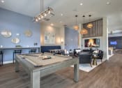 Thumbnail 66 of 92 - a clubhouse with a pool table and a fireplace