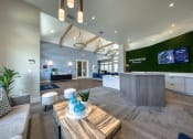 Thumbnail 62 of 92 - a lobby with a reception desk and a table with chairs
