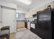Thumbnail 14 of 27 - Kitchen with Black Appliances at Meadows at Capitol Heights, Capitol Heights, Maryland, 20743