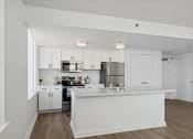 Thumbnail 11 of 50 - an open kitchen and a living room at The Zenith, Baltimore