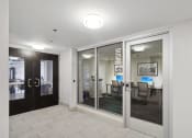 Thumbnail 42 of 50 - a view of a conference room with glass doors and a table with chairs at The Zenith, Maryland