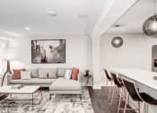 Thumbnail 3 of 28 - a living room with white walls and hardwood floors at Hamilton at Kings Place, Columbia, MD 21046