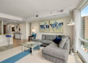 Thumbnail 7 of 50 - Living area with stools for the island for entertainment at The Zenith, Baltimore