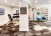 Thumbnail 20 of 28 - a view of the fitness center with weights and other exercise equipment at Hamilton at Kings Place, Columbia City