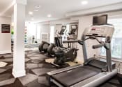 Thumbnail 18 of 28 - a spacious fitness room with treadmills and elliptical trainers at Hamilton at Kings Place, Columbia, 21046