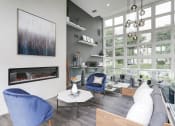 Thumbnail 24 of 35 - a living room with a large window and a fireplace at Madison at Eden Brook, Maryland