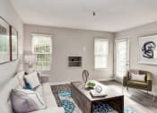 Thumbnail 11 of 28 - a living room with a couch and a coffee table at Hamilton at Kings Place, Maryland