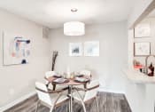 Thumbnail 8 of 28 - a dining room with a table and chairs at Hamilton at Kings Place, Columbia City