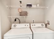Thumbnail 16 of 28 - a small laundry room with two washers and a dryer at Hamilton at Kings Place, Maryland