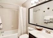 Thumbnail 14 of 28 - a bathroom with a shower toilet and sink at Hamilton at Kings Place, Columbia City