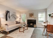 Thumbnail 17 of 35 - a living room with a fireplace and a couch at Madison at Eden Brook, Columbia, MD