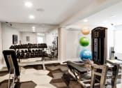 Thumbnail 17 of 28 - a spacious fitness room with weights and other exercise equipment at Hamilton at Kings Place, Columbia, MD, 21046