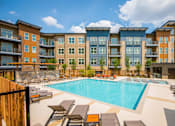 Thumbnail 1 of 84 - Relaxing Pool Area With Sundeck at Mira Upper Rock, Rockville, MD