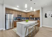 Thumbnail 3 of 35 - Fitted Kitchen With Island Dining at Woodmore Apartments, Maryland