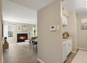 Thumbnail 3 of 35 - a living room and dining room with fireplace at Madison at Eden Brook, Columbia, 21046