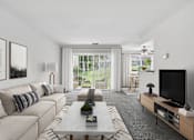Thumbnail 1 of 40 - Spacious living room with patio access at The Brook At Columbia Apartments, Maryland, 21044