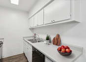 Thumbnail 3 of 33 - A kitchen with a bowl of apples on the counter at Riviera Park, Chandler Arizona