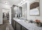 Thumbnail 5 of 45 - A bathroom with a vanity, sink, and mirror at Aspire Apollo, Camp Springs