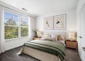Thumbnail 4 of 45 - a bedroom with a bed and a large window at Aspire Apollo, Camp Springs, MD