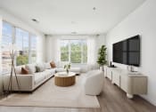 Thumbnail 1 of 45 - A modern living room with a white sofa, a round coffee table, and a flat-screen TV at Aspire Apollo, Camp Springs, MD