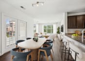 Thumbnail 2 of 45 - a living room and kitchen with a dining table and chairs at Aspire Apollo, Camp Springs