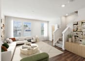 Thumbnail 1 of 30 - a living room with a white couch and a staircase at Refinery Row, MD 21224