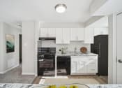 Thumbnail 4 of 27 - Kitchen with Black Appliances at Meadows at Capitol Heights, Capitol Heights, MD, 20743