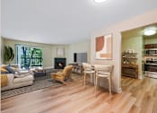 Thumbnail 2 of 24 - A living room with a fireplace at Poplar Glen Apartments, Maryland, 21044.