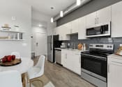Thumbnail 12 of 34 - Modern Kitchens with Quartz and Stainless Finishes at The Oxford Apartments, Oxon Hill, 20745