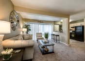 Thumbnail 16 of 27 - Decorated Living Room With Natural Light with a couch and a coffee table at Meadows at Capitol Heights, Capitol Heights, MD, 20743