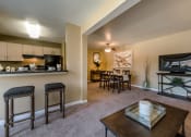 Thumbnail 18 of 27 - Fully Equipped Eat-In Kitchen with living room view at Meadows at Capitol Heights, Capitol Heights, Maryland