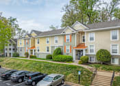 Thumbnail 46 of 48 - Apartment complex with a parking lot in front at Ellicott Grove, Ellicott City, MD 21043