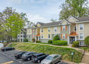 Thumbnail 44 of 48 - Apartment complex with a parking lot in front at Ellicott Grove, Ellicott City, MD 21043