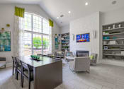 Thumbnail 29 of 48 - A modern kitchen with a large island and a TV mounted on the wall at Ellicott Grove, Ellicott City, MD 21043