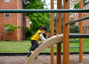Thumbnail 18 of 18 - boy on playground at Hamilton Manor Apartments, Maryland, 20782