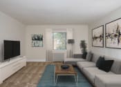 Thumbnail 1 of 18 - a living room with a couch and a coffee table at Hamilton Manor Apartments, Maryland, 20782
