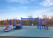 Thumbnail 50 of 54 - an empty playground with slides and a swing set at Villages at Morgan Metro, Maryland, 20785