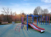 Thumbnail 49 of 54 - a playground with a slide and other equipment in a park at Villages at Morgan Metro, Landover