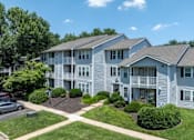 Thumbnail 55 of 56 - Apartment complex with multiple buildings and green lawns at Madison at Eden Brook, 21046