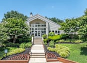 Thumbnail 51 of 56 - A house with a front yard and a set of stairs leading to the front door at Madison at Eden Brook, 21046