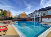 Thumbnail 28 of 34 - our apartments have a large pool with a blue sky above it at MetroPlace at Town Center, Maryland, 20746