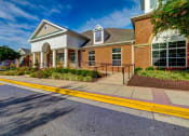Thumbnail 33 of 34 - Clubhouse Entrance at MetroPlace at Town Center, Camp Springs, 20746