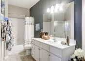 Thumbnail 19 of 34 - a bathroom with a sink and a shower and a toilet at MetroPlace at Town Center, Maryland, 20746