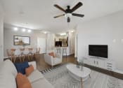 Thumbnail 4 of 34 - a living room with a couch and a tv at MetroPlace at Town Center, Maryland