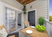 Thumbnail 14 of 34 - a patio with a wooden table and chairs and a black door at MetroPlace at Town Center, Camp Springs, 20746